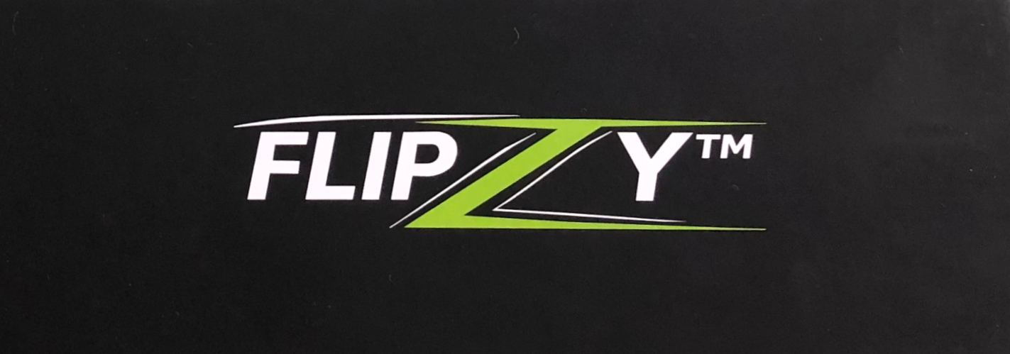 The FLIPZY presentation box: matte black card with the FLIPZY logo and the tagline Flip. Relax. Focus. Enjoy.
